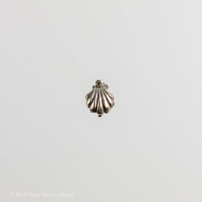 Main view of an oyster shell charm.