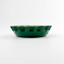 Second side view of green and yellow Perrier bottle cap ashtray 