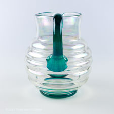 Rear view of Iridescent Ribbed Glass Jug with Blue-Green Handle
