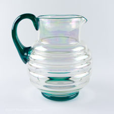 Left side view of Iridescent Ribbed Glass Jug with Blue-Green Handle