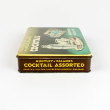 Left side view of Huntley & Palmers Cocktail Biscuits Tin